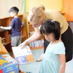 Morning Star teacher helping a student to select the correct book level